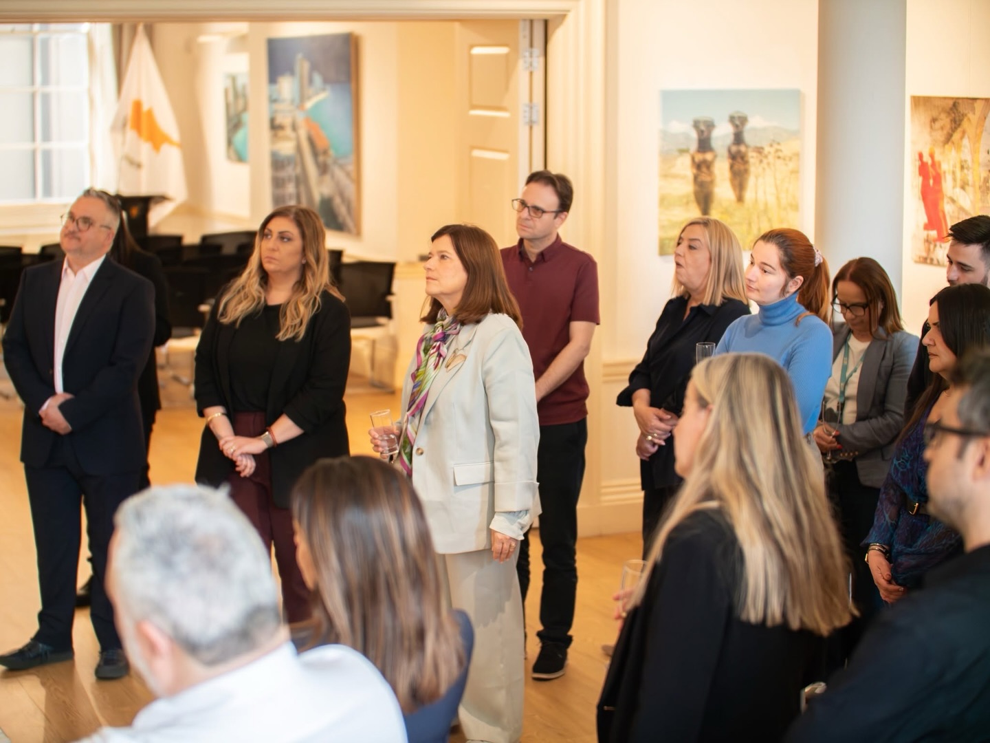 Visitors listening in a gallery during There Is An Island III