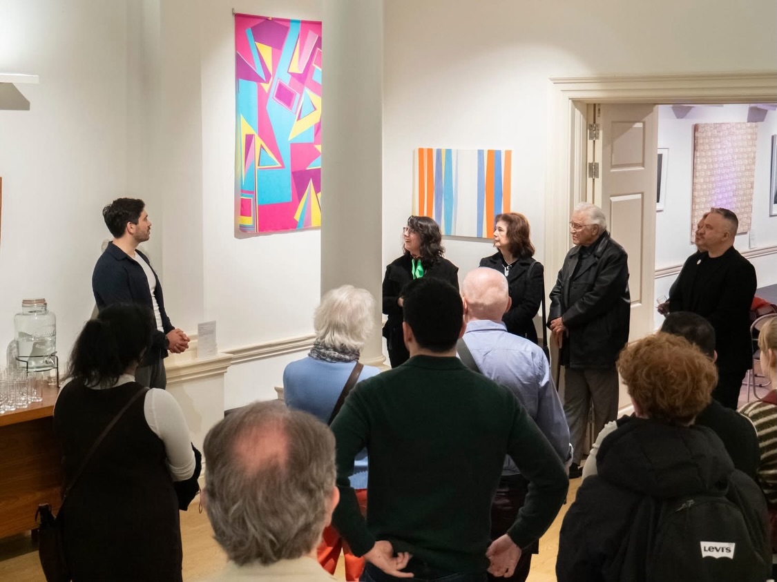 Visitors listening during an artist-led tour of There Is An Island III