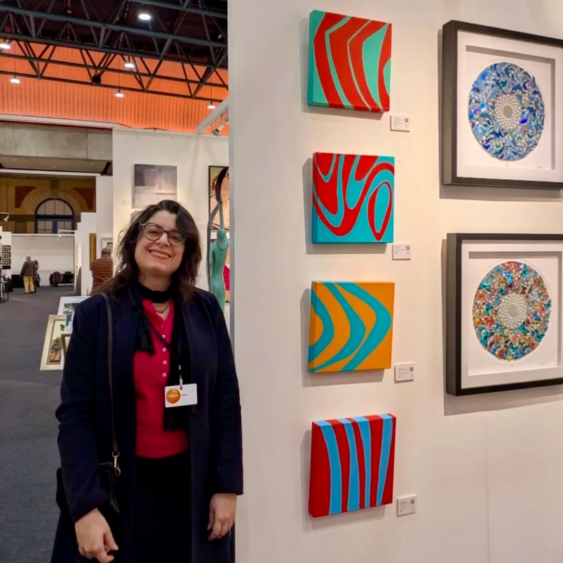 Kika Pierides beside her artworks at Fresh Art Fair