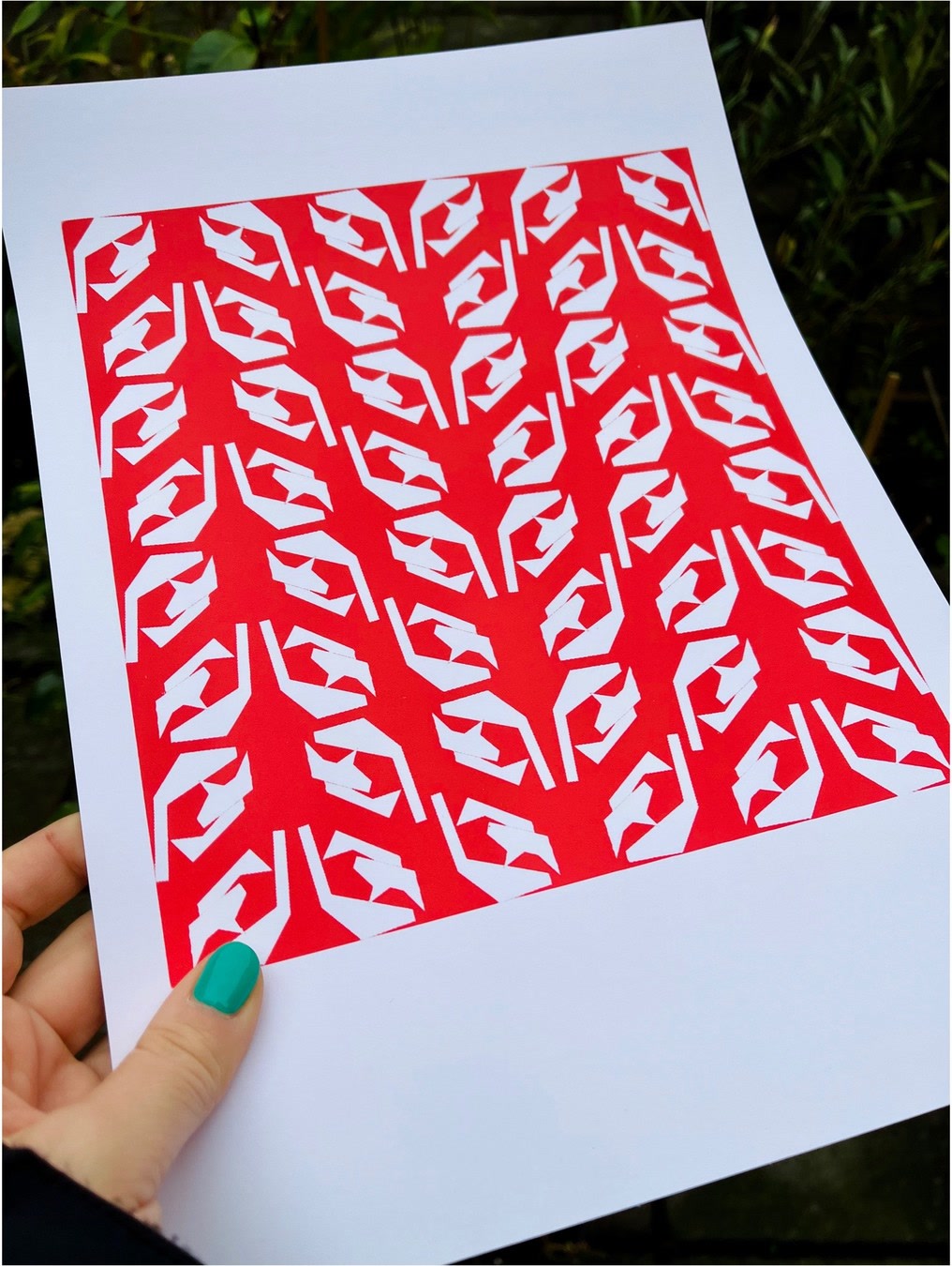 Hand holding pattern print.