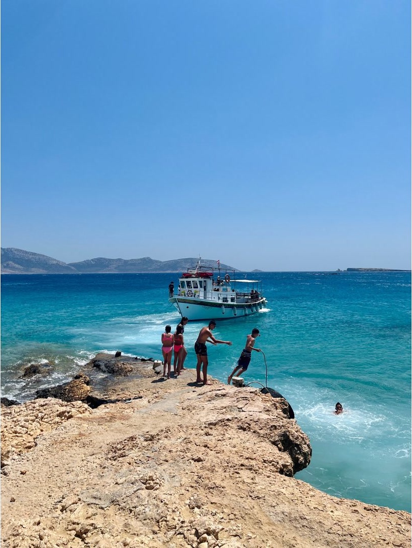 Teenagers cliff jumping greece.