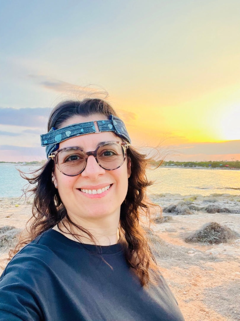 Woman headband sunset selfie.